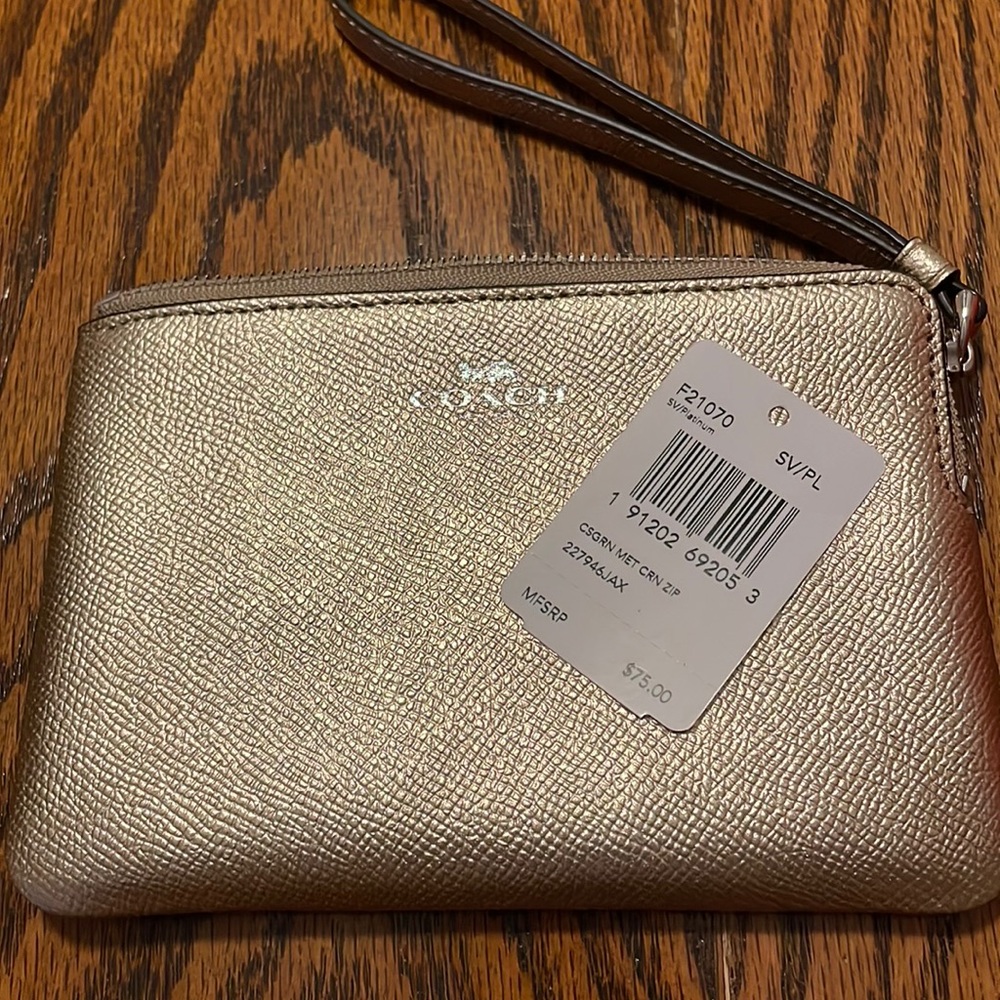Wristlet. Zipper Top. Slots for 2 credit cards